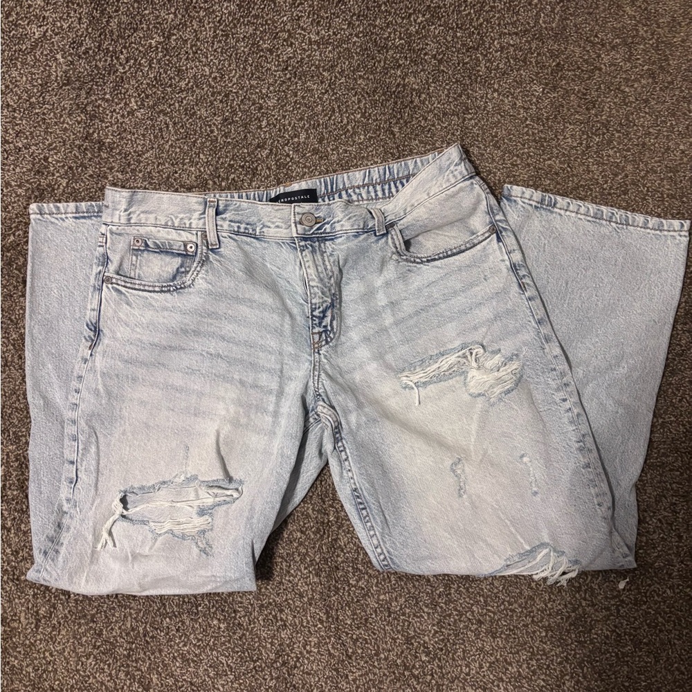 Aeropostale distressed mom jeans in a light wash denim.